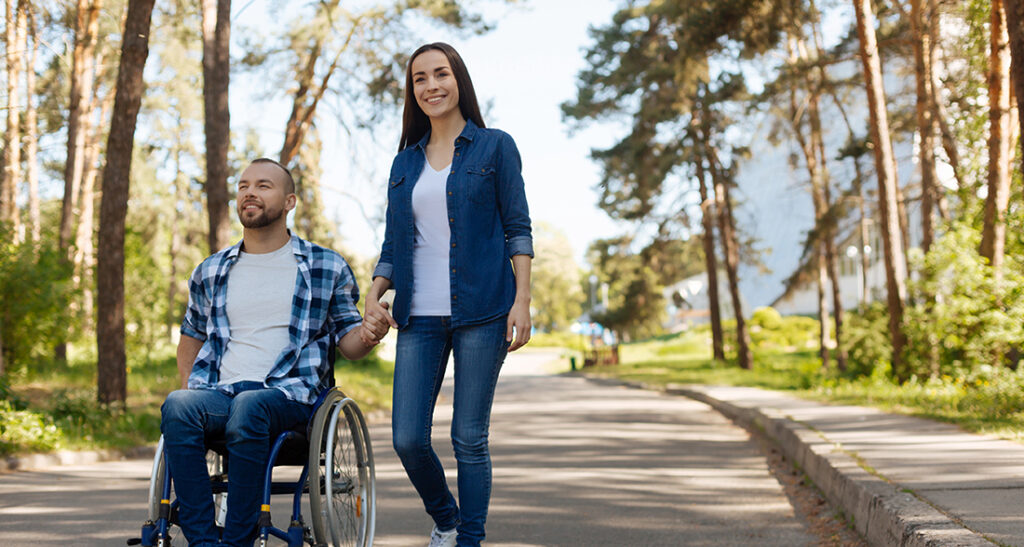 Man in wheelchair with woman